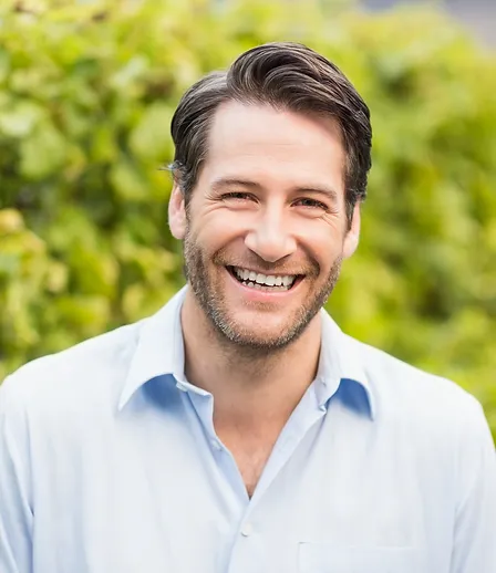 Man smling and with happy face after getting TRT Therapy at Boost Wellness Clinic